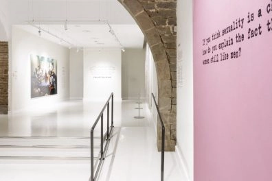 Modern artworks with bold colors and quotes displayed at Moco Museum Barcelona.