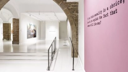 Modern artworks with bold colors and quotes displayed at Moco Museum Barcelona.