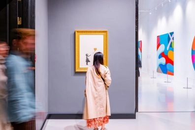 Visitors viewing Banksy’s work in a gallery at Moco Museum Barcelona Visitors viewing Banksy’s work in a gallery at Moco Museum Barcelona