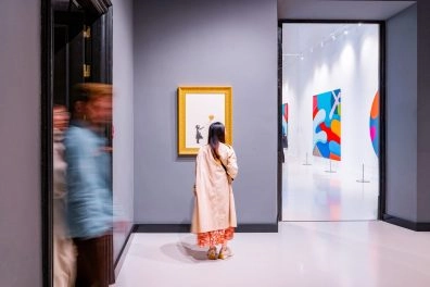 Visitors viewing Banksy’s work in a gallery at Moco Museum Barcelona