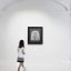 Visitor looking at Kusama's iconic pumpkin artwork.