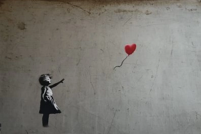Banksy’s iconic “Girl With Balloon” artwork featuring a red heart-shaped balloon at Moco Museum Barcelona