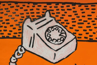 Keith Harings popart-schilderij van een telefoon op een feloranje achtergrond in Moco Museum Amsterdam.