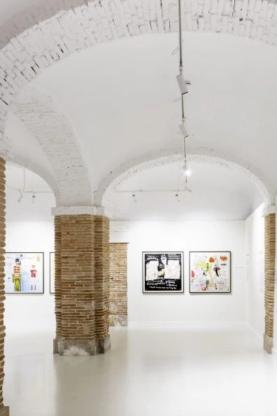 White interior with arched ceilings and Jean-Michel Basquiat’s artworks at Moco Museum Barcelona