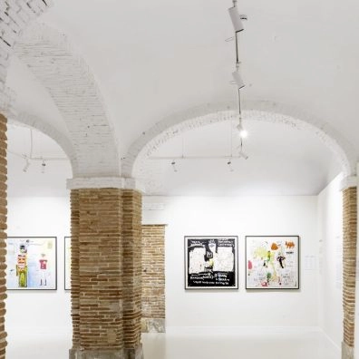 White interior with arched ceilings and Jean-Michel Basquiat’s artworks at Moco Museum Barcelona