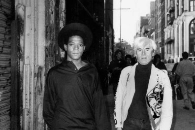 Black-and-white photo of Jean-Michel Basquiat and Andy Warhol.