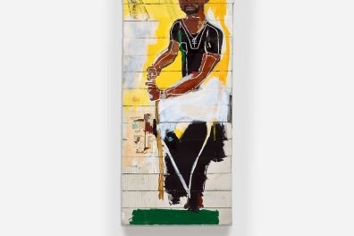 Basquiat’s “To Repel Ghosts” painting featuring a black figure on yellow and white background at Moco Museum Barcelona