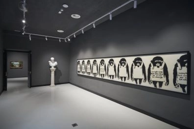Exhibition room with Banksy’s riot police series on display at Moco Museum Barcelona.