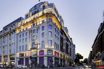 Street view of Moco Museum London on prominent corner in Mayfair.