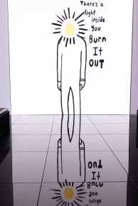 Minimalist burnout figure artwork by Robbie Williams with text, exhibited at Moco Museum Amsterdam. Minimalist burnout figure artwork by Robbie Williams with text, exhibited at Moco Museum Amsterdam.