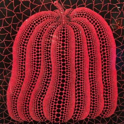 Yayoi Kusama red pumpkin sculpture with black net pattern
