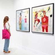 Visitor viewing Basquiat’s superhero-themed artworks at Moco Museum Barcelona Visitor viewing Basquiat’s superhero-themed artworks at Moco Museum Barcelona