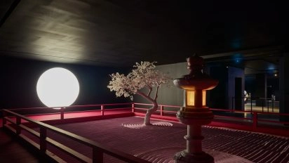 Minimalist Zen-like installation with a glowing moon, sand Lunar Garden, and white tree by Daniel Arsham at Moco Museum London.