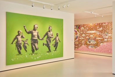 Banksy artwork of next to vibrant abstract piece at Moco Museum London