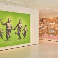 Banksy artwork of next to vibrant abstract piece at Moco Museum London