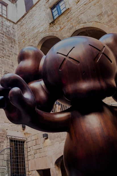 KAWS Companion sculpture in Moco Museum Barcelona courtyard entrance